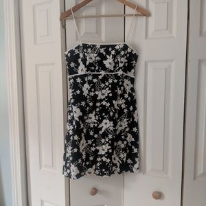 Form fitting black dress with white flowers
